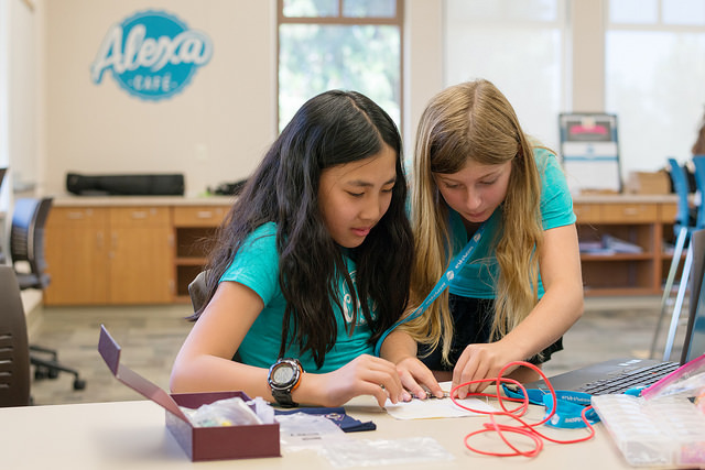girls work on wearable electronics project
