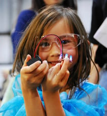 young girl with electronic project