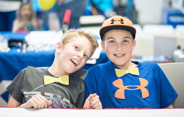 students wearing light up bow ties they created