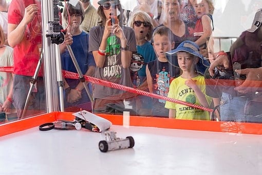 Students watch the combat bots competition at SparkFun's AVC