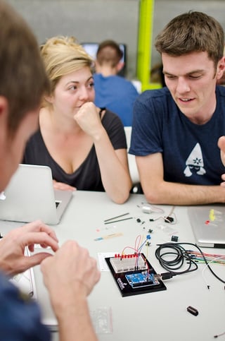 students collaborating on electronics project