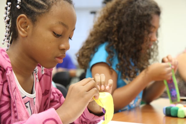 girls working with LilyPad e-textiles