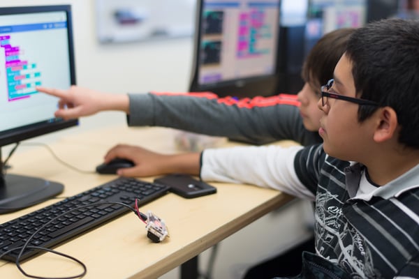 students working with micro:bit and MakeCode