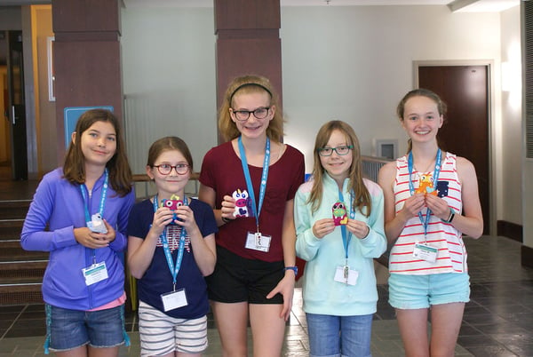 Five Alexa Cafe students holding their plush projects