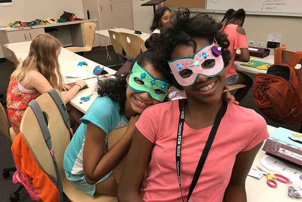 Made-by-Girls participants pose wearing light up masks